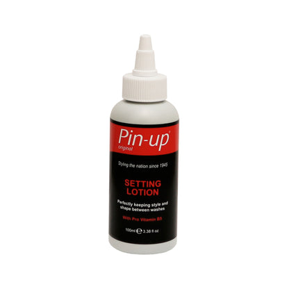 A bottle of Pin-up Perm Setting Lotion with a pointed nozzle cap and a red, black, and white label describes it as a hair styling lotion for keeping hair perfectly styled between washes.